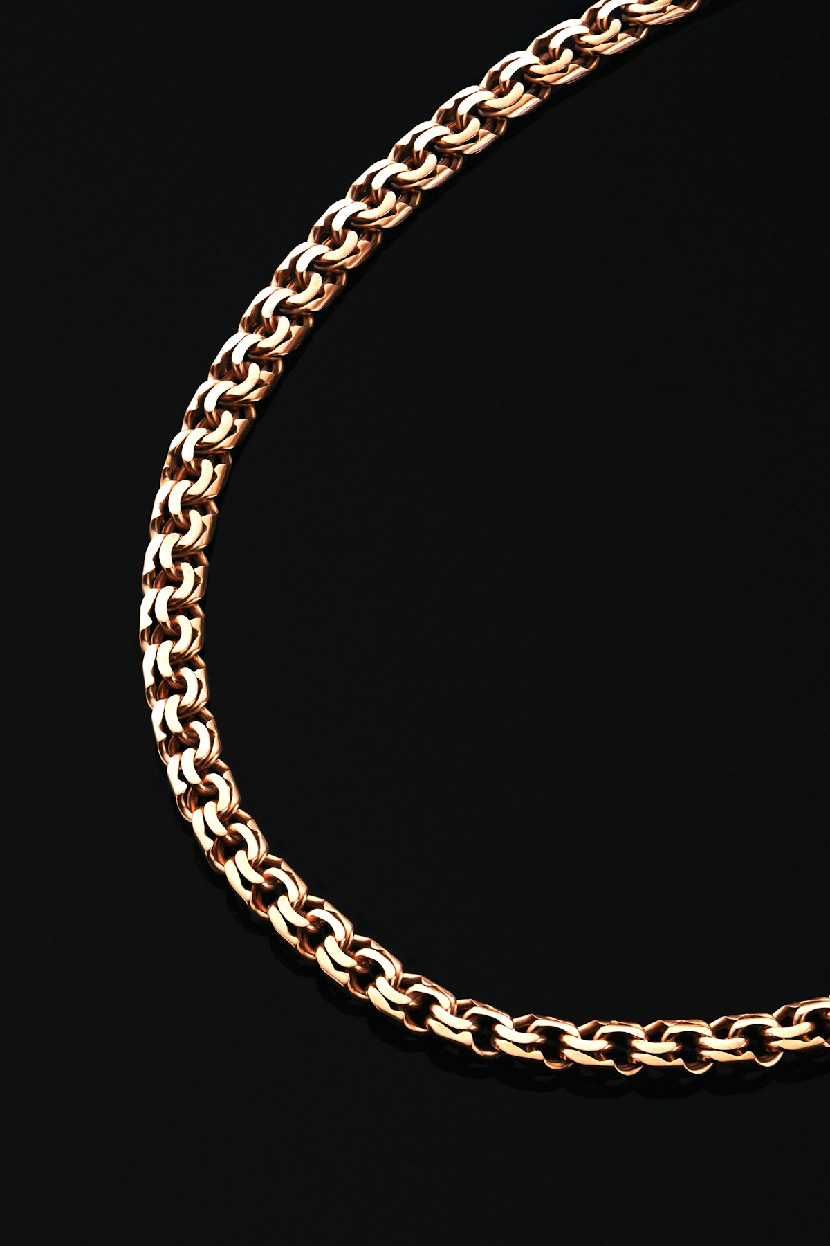 Gold chain in a flowing loop — the Infinity Name Pendant design