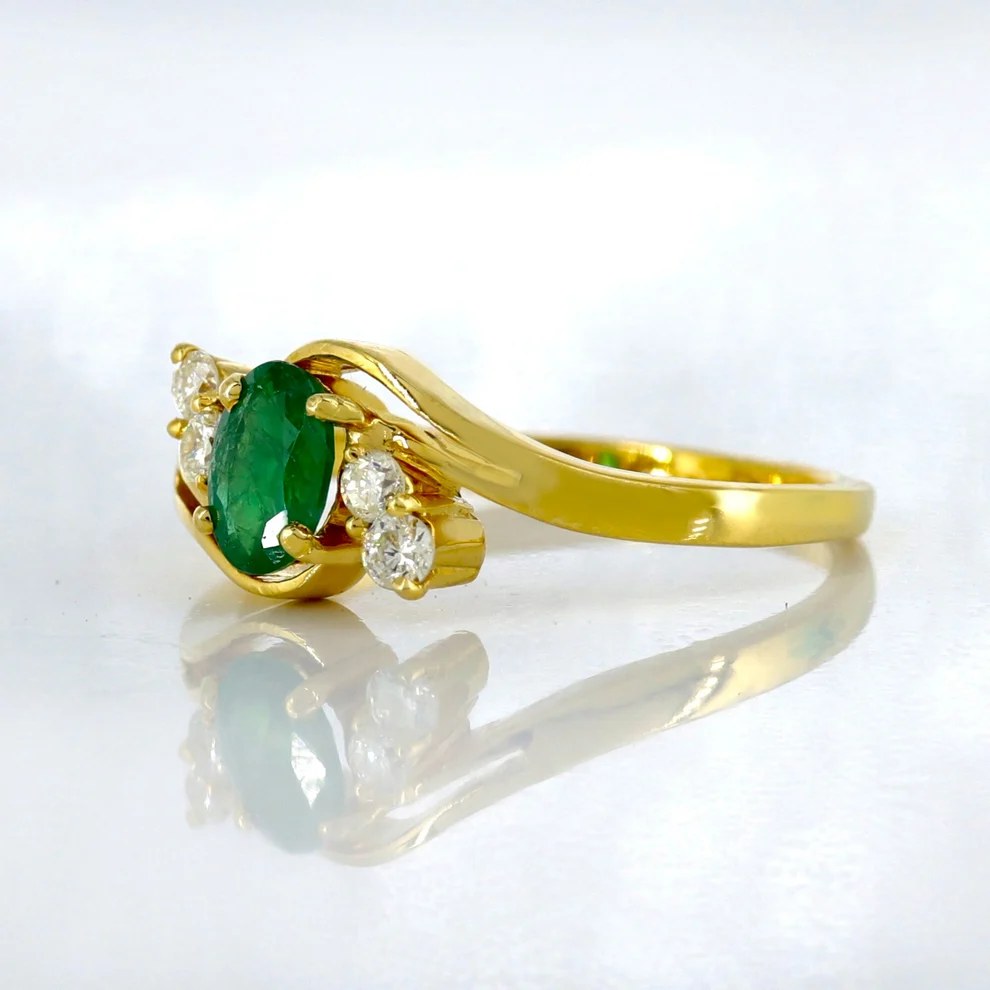 Gold ring with a gemstone top — the Heart Name Ring design